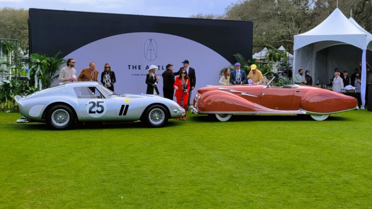 A silver competition Ferrari and a coachbuilt prewar roadster shown side by side as Best in Show winners at the Amelia Island Concours d’Elegance, an engagement in the season calendar of The Mansa Court