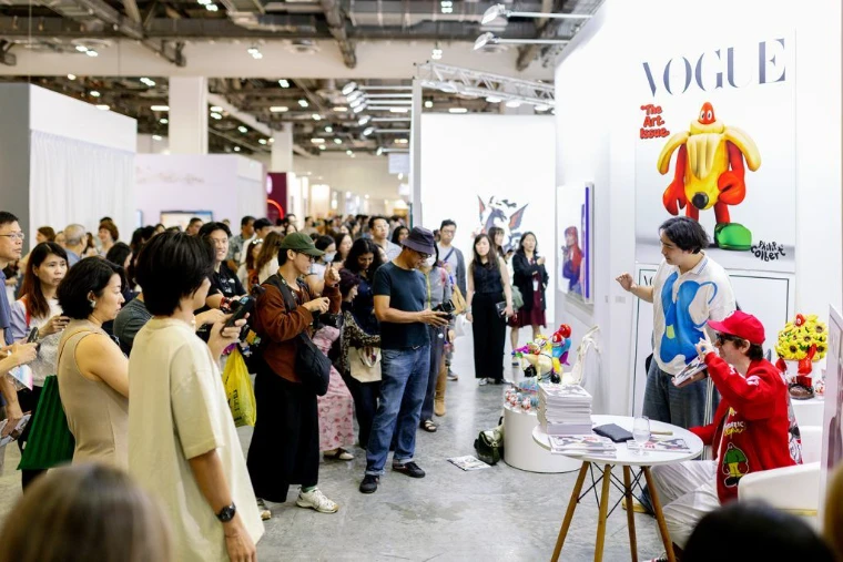 An artist signing at Art SG, Marina Bay Sands, Singapore, an engagement in the season calendar of The Mansa Court