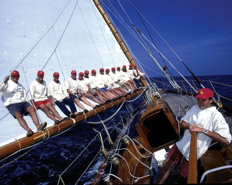 The crew of a classic yacht working the deck during Barbados Sailing Week off Bridgetown, an engagement in the season calendar of The Mansa Court