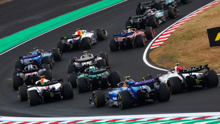 The field fanning out through the opening corners at the Formula 1 Japanese Grand Prix, Suzuka Circuit, an engagement in the season calendar of The Mansa Court