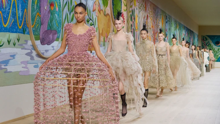 Models in procession for a couture finale during Haute Couture Week in Paris, an engagement in the season calendar of The Mansa Court
