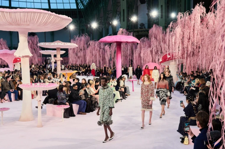 A couture show staged beneath the glass of the Grand Palais during Haute Couture Week in Paris, an engagement in the season calendar of The Mansa Court