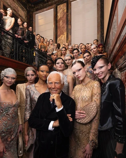 A couture finale on the staircase of a Paris salon during Haute Couture Week, an engagement in the season calendar of The Mansa Court