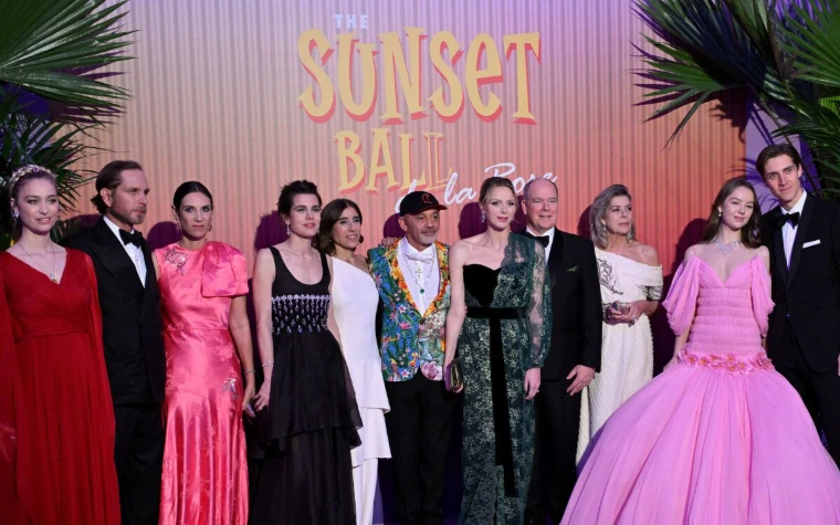 The princely family and the ball’s designer on stage before the Sunset Ball backdrop at Le Bal de la Rose, Monte Carlo, a March engagement in the season calendar of The Mansa Court