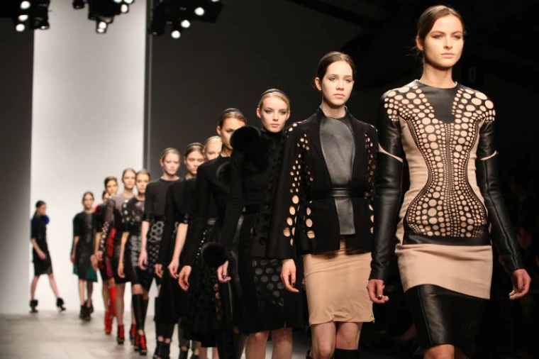 The full cast walking the finale in cut-out leather and black tailoring at London Fashion Week, an engagement in the season calendar of The Mansa Court