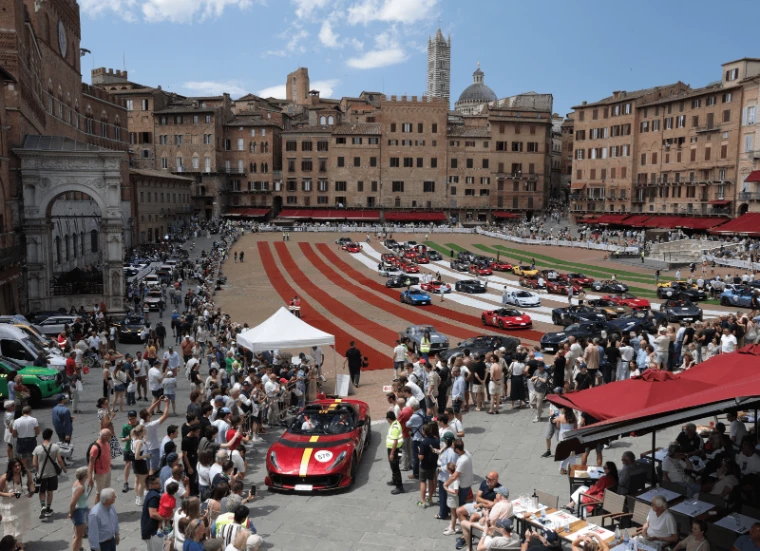 The modern cars of the tribute line up on red and white stripes across the Campo, the cathedral tower above and the crowds around. The Mille Miglia, from Brescia to Rome and back, in the season calendar of The Mansa Court