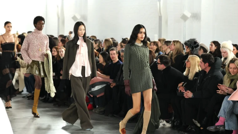 Models walking a daylit runway before a seated front row at New York Fashion Week, an engagement in the season calendar of The Mansa Court