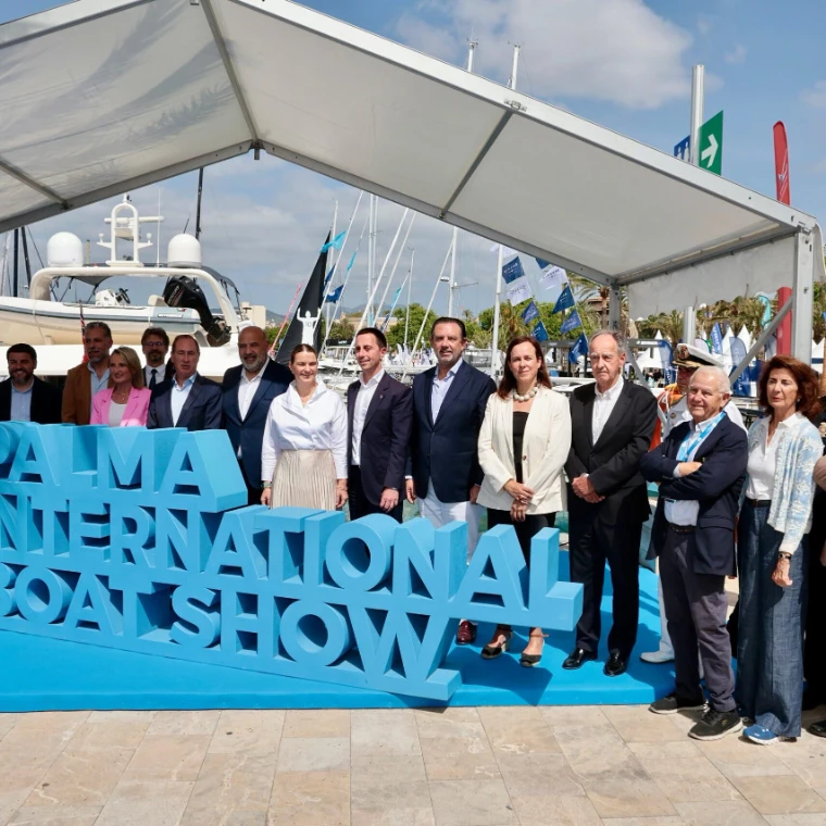 Officials and guests gathered behind the show sign at the opening at the Palma International Boat Show, Palma de Mallorca, a late-April engagement in the season calendar of The Mansa Court