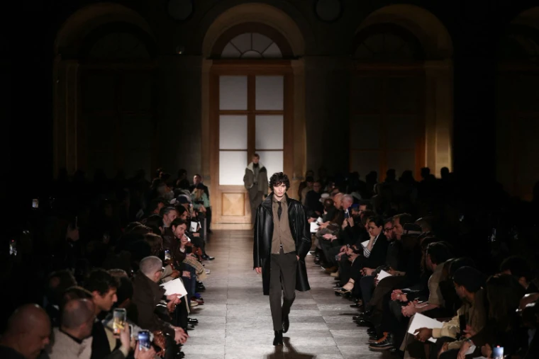 A collection on the runway at Paris Fashion Week Menswear, an engagement in the season calendar of The Mansa Court