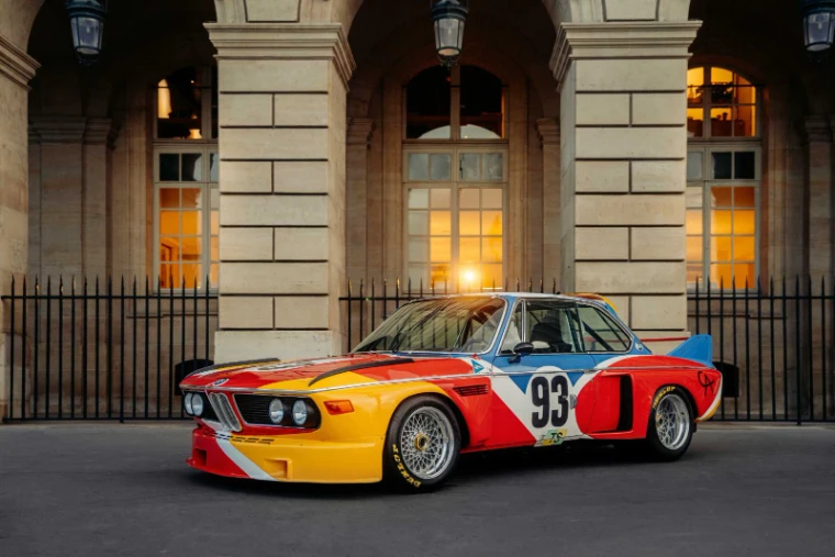The Alexander Calder BMW 3.0 CSL art car under a Paris arcade during Rétromobile week, an engagement in the season calendar of The Mansa Court