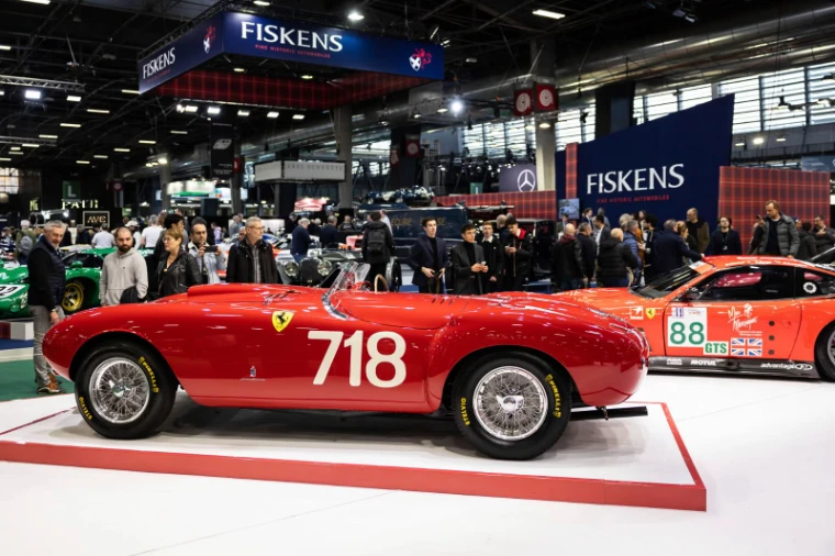 A red Ferrari barchetta numbered 718 on the Fiskens stand at Rétromobile, Paris, an engagement in the season calendar of The Mansa Court