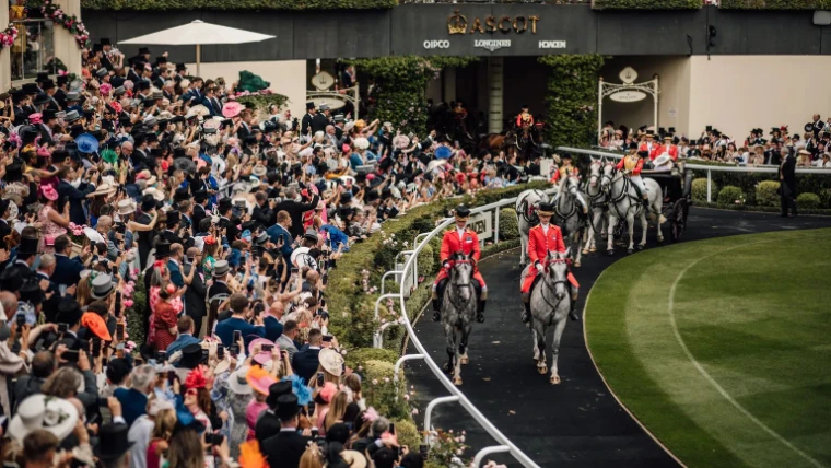 Outriders in scarlet on grey horses leading the Royal Procession into the Parade Ring at Ascot Racecourse, an engagement in the season calendar of The Mansa Court
