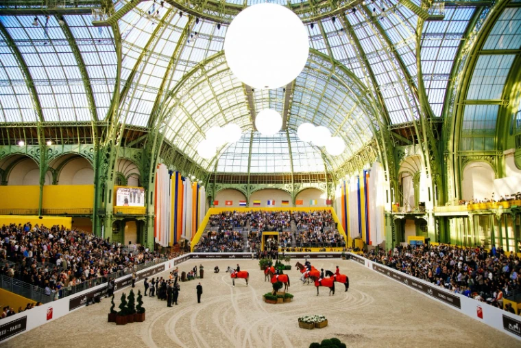 Riders gathered on the sand beneath the glass dome of the Grand Palais at Saut Hermès, the spring jumping meeting in Paris in the season calendar of The Mansa Court
