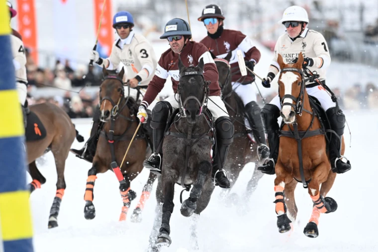 High-goal polo at the Snow Polo World Cup on the frozen lake at St. Moritz, ponies at full stretch on the snow, an engagement in the season calendar of The Mansa Court