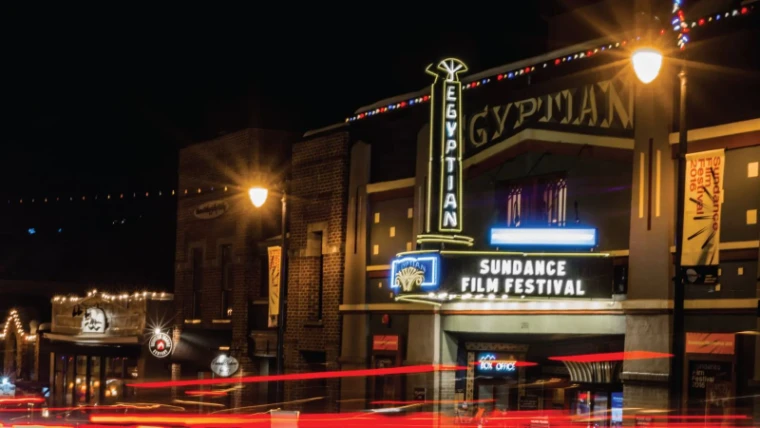 Park City lit at night during the Sundance Film Festival, an engagement in the season calendar of The Mansa Court
