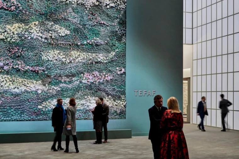 Guests before the flower wall at the TEFAF Maastricht entrance, the March art fair in the season calendar of The Mansa Court