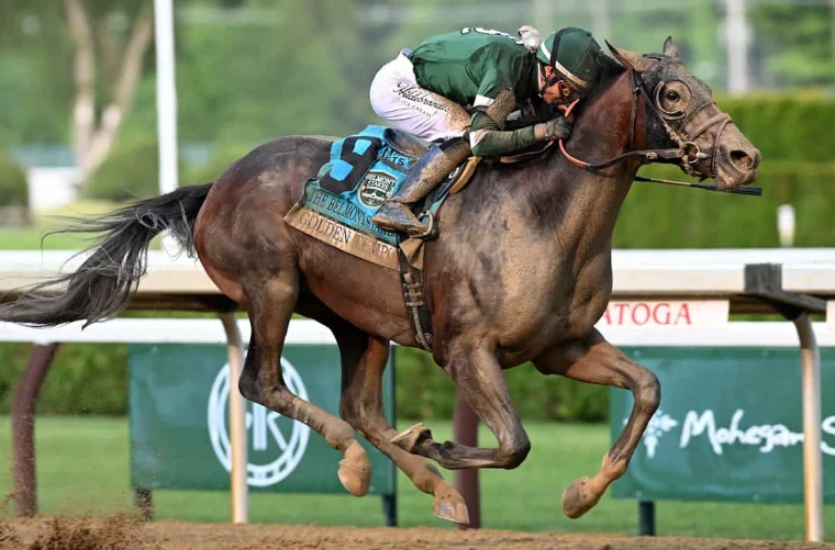 A mud-splashed colt stretches out towards the wire at Saratoga. The Belmont Stakes, the final leg of the Triple Crown, in the season calendar of The Mansa Court