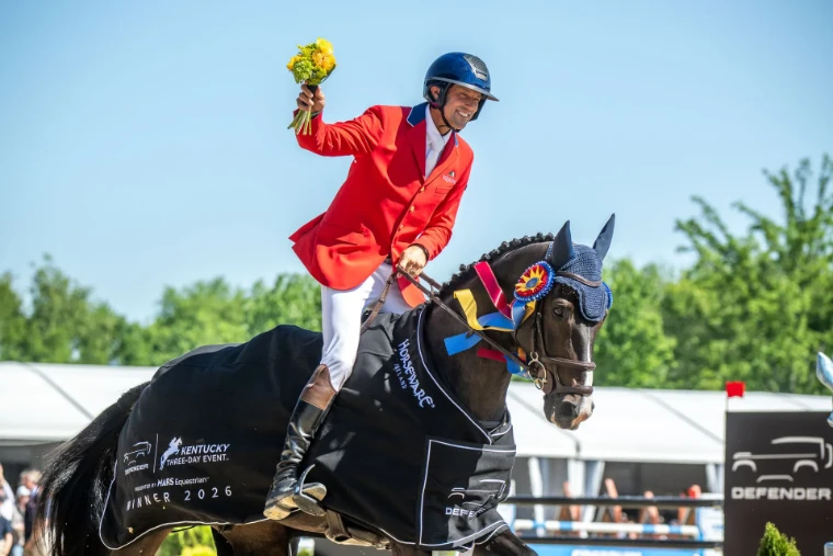 The winning rider in a red coat raising a bouquet from the saddle, his horse in the winner’s rug and rosette, at the Kentucky Three-Day Event, Lexington, a late-April engagement in the season calendar of The Mansa Court