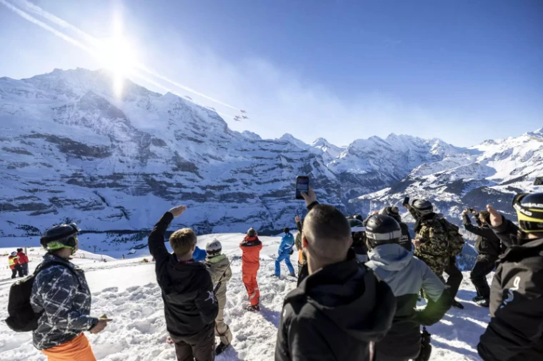 The Patrouille Suisse flying over Wengen on Lauberhorn race day, an engagement in the season calendar of The Mansa Court