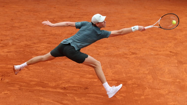 A player at full stretch for the ball on the red clay of the Rolex Monte-Carlo Masters, Monte Carlo, an April engagement in the season calendar of The Mansa Court