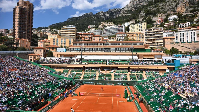 Court Rainier III at the Monte-Carlo Country Club, its stands full beneath the terraced apartments and limestone cliffs above Monaco, during the Rolex Monte-Carlo Masters, Monte Carlo, an April engagement in the season calendar of The Mansa Court