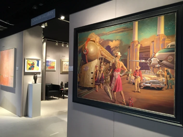 Paintings and bronze sculpture on the Cavalier Galleries stand at a Palm Beach art and antiques fair, a large canvas of a streamlined locomotive in the foreground, at The Palm Beach Show, West Palm Beach, an engagement in the season calendar of The Mansa Court
