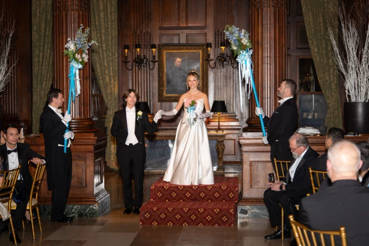 A debutante presented between the standards at the Piarist Debutante Ball, New York, an engagement in the season calendar of The Mansa Court