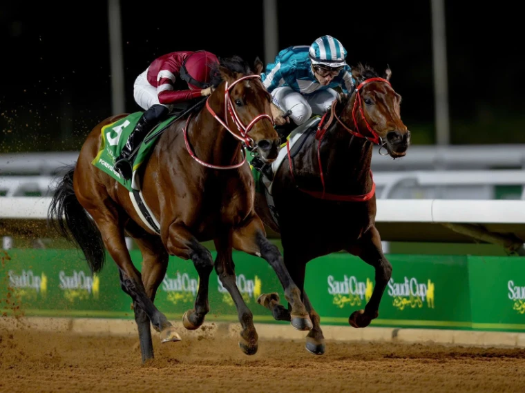 Two colts locked together in the closing strides on the floodlit dirt at The Saudi Cup, Riyadh, an engagement in the season calendar of The Mansa Court