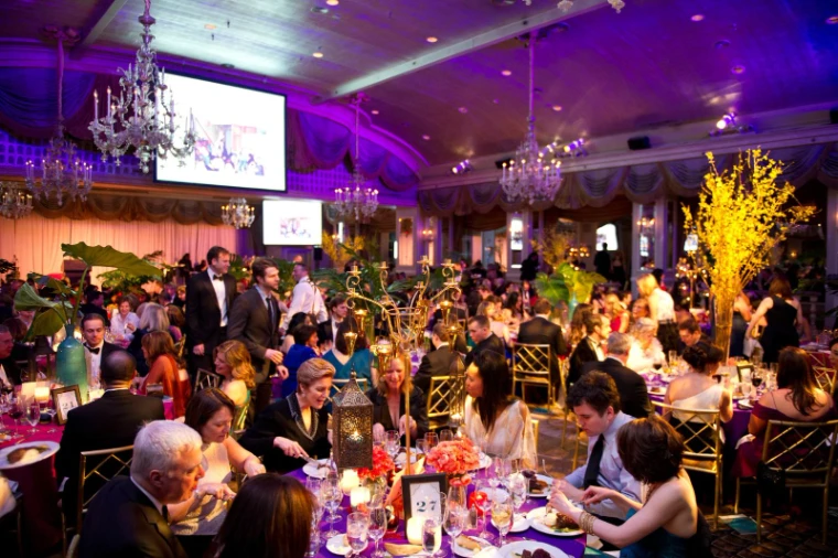 Dinner served across a chandeliered ballroom in candlelight at The Winter Ball, New York, an engagement in the season calendar of The Mansa Court
