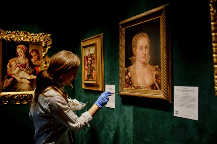 Old master paintings hung on a dealer’s stand at the Winter Show, Park Avenue Armory, New York, an engagement in the season calendar of The Mansa Court