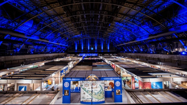 Dealers’ stands under the vaulted drill hall of the Park Avenue Armory at the Winter Show, an engagement in the season calendar of The Mansa Court