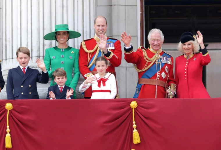 The balcony of Buckingham Palace after the parade, hung with crimson and gold. Trooping the Colour on Horse Guards Parade, London, in the season calendar of The Mansa Court