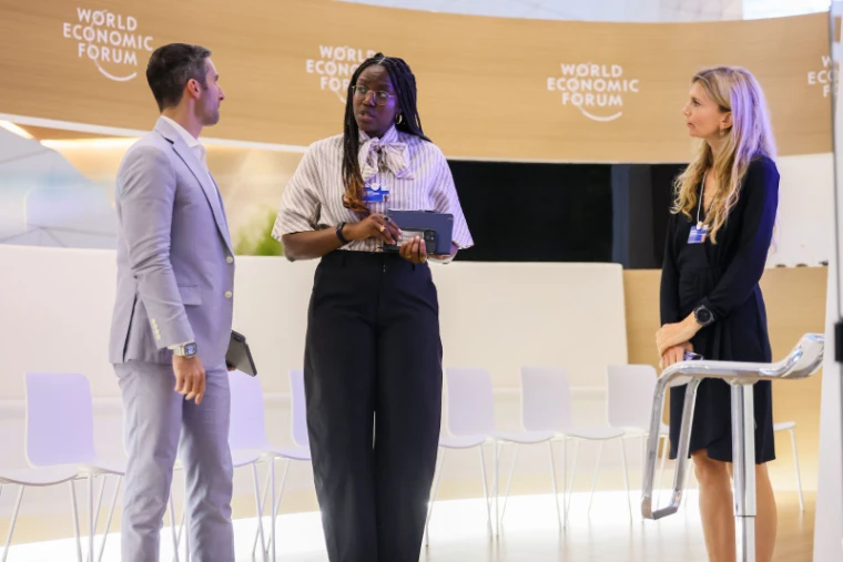 Participants in conversation between sessions at Davos, at World Economic Forum, an engagement in the season calendar of The Mansa Court