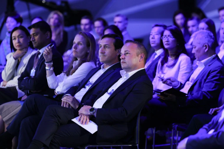 The audience of a session at the World Economic Forum in Davos, an engagement in the season calendar of The Mansa Court